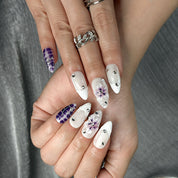 white flower nails medium almond press-on nails in purple and white with simple floral accents summer holiday style