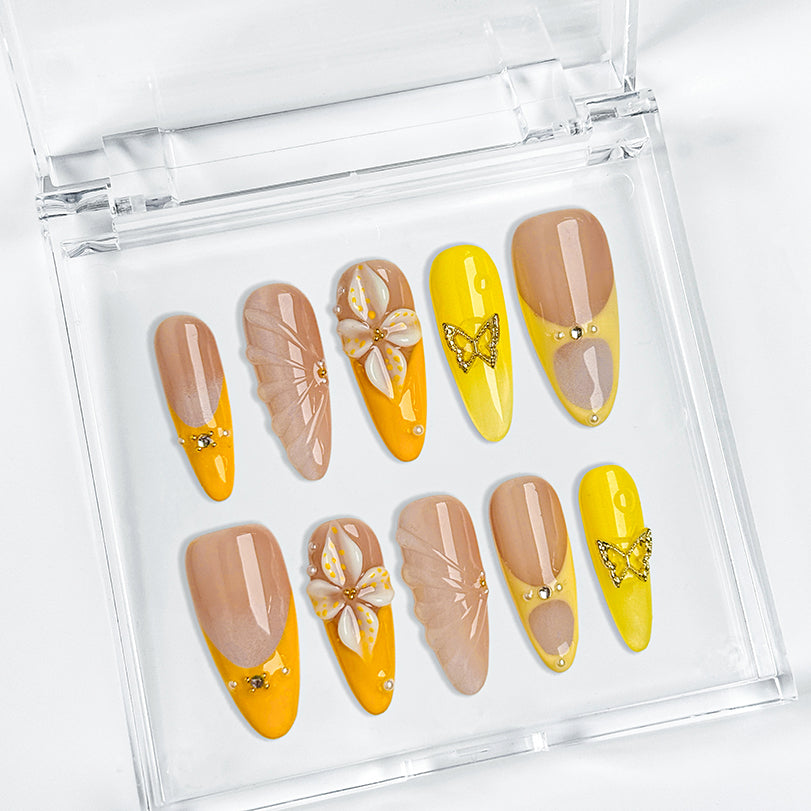 yellow flower nails long almond press-on nails with nude base orange and yellow french tips floral accents summer beach party style